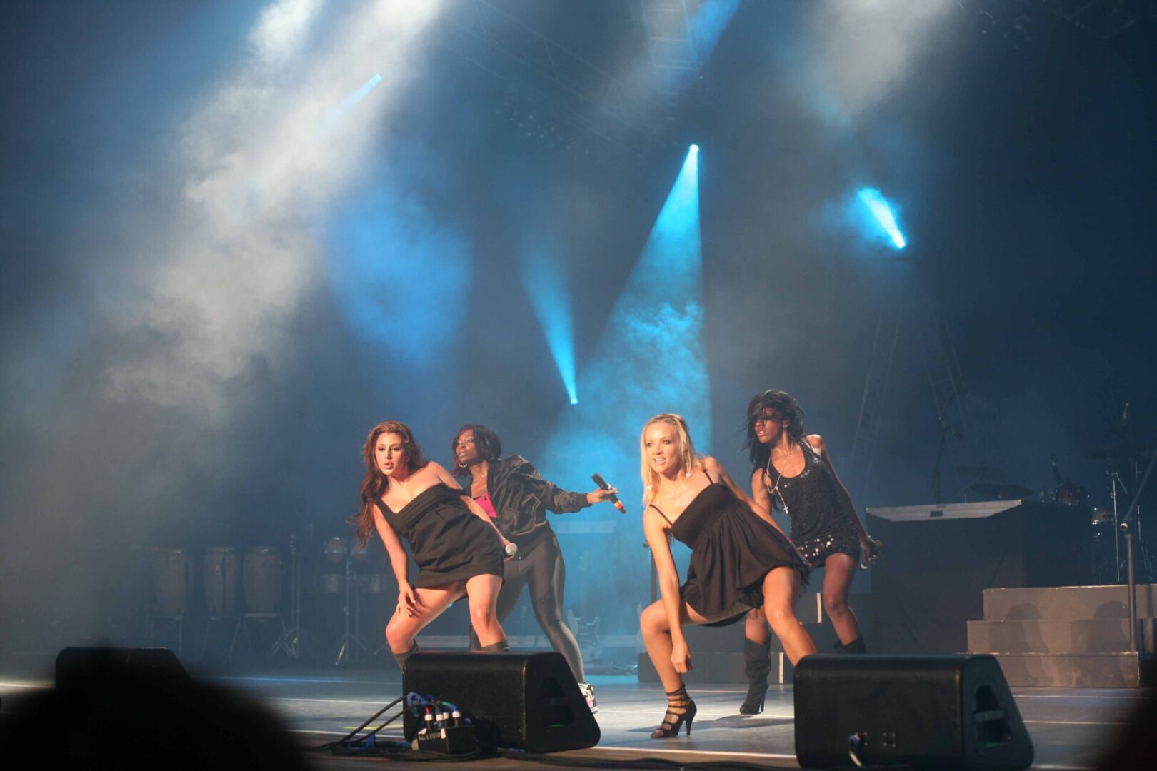 A group of people on stage performing.