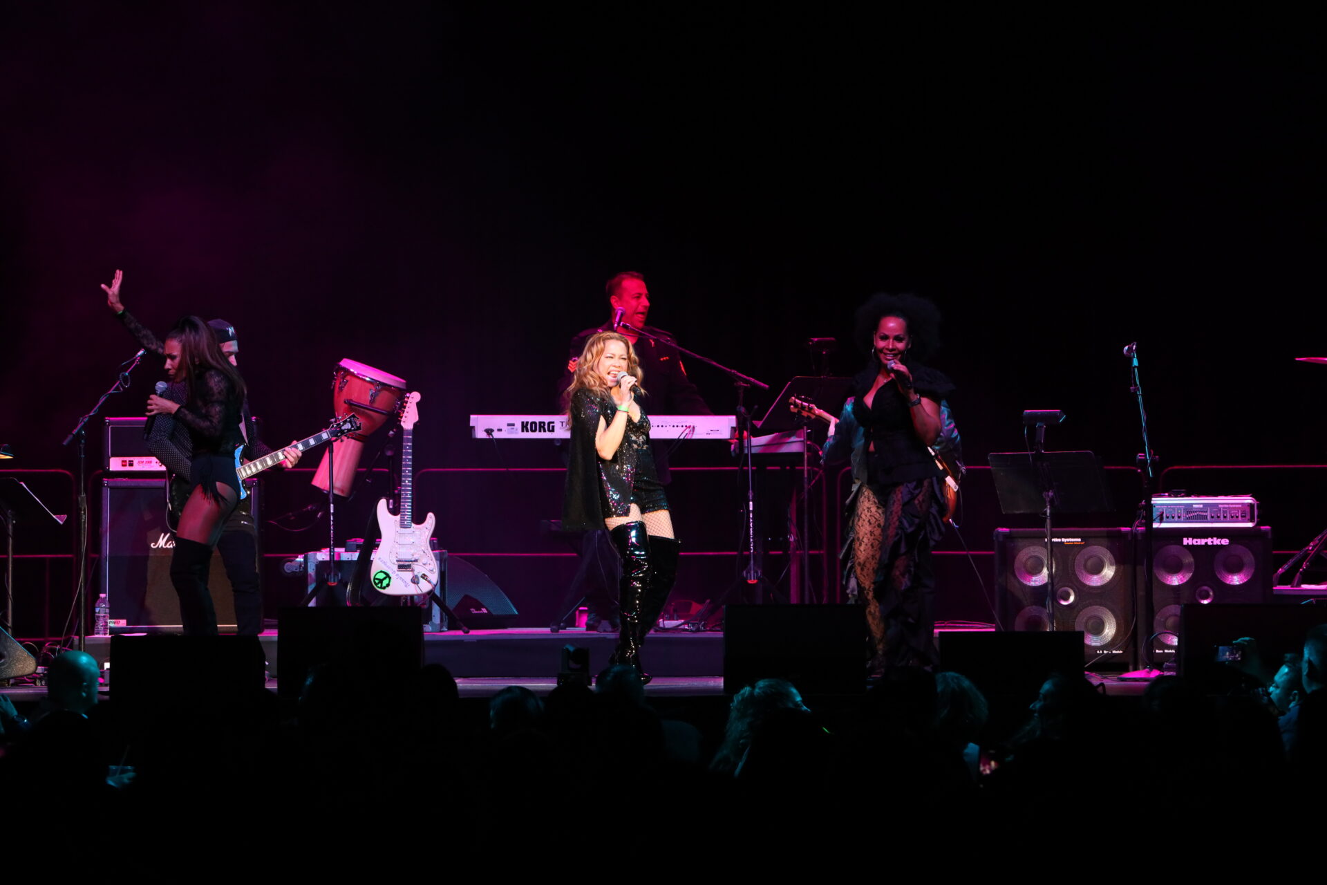 A group of people on stage performing.