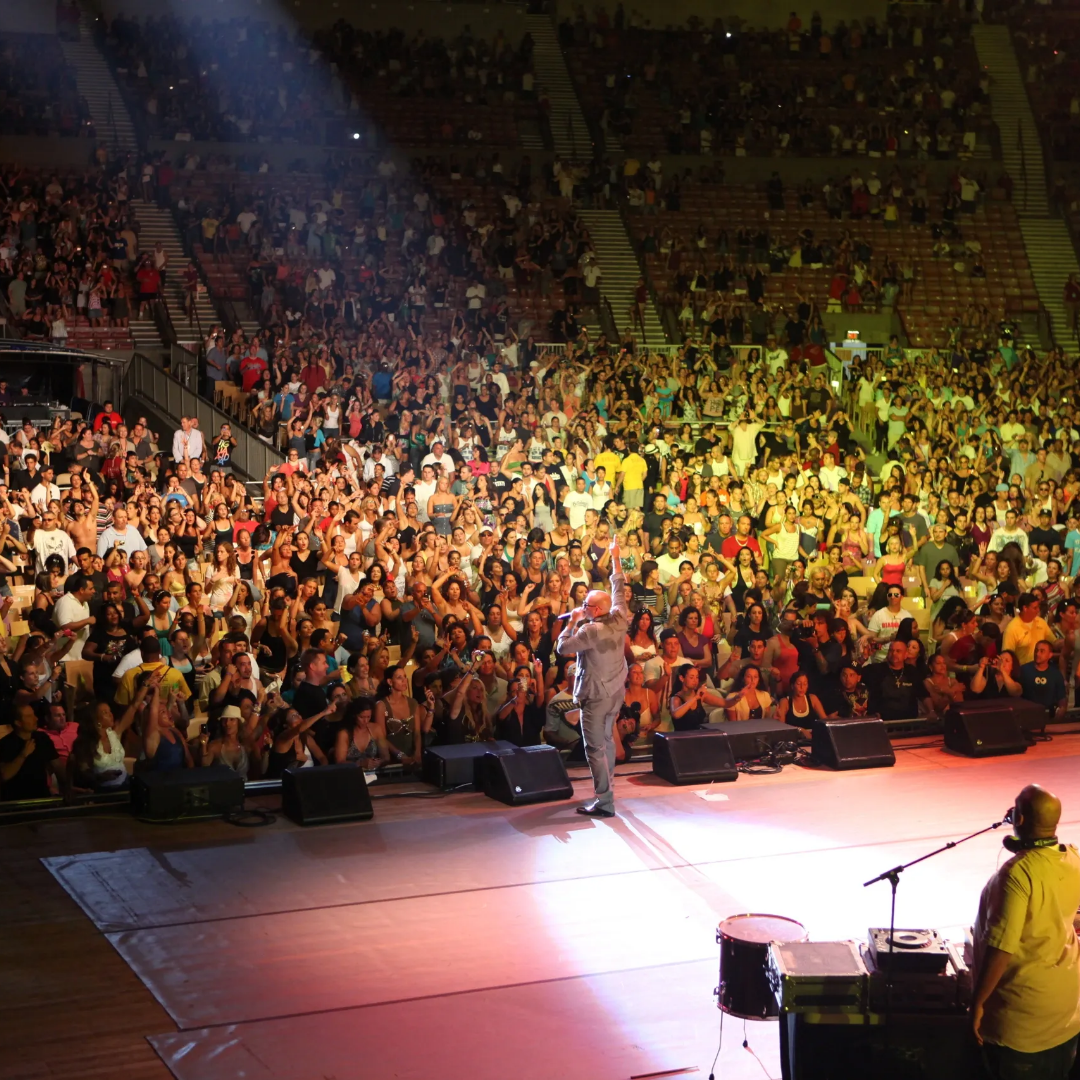 A large crowd of people in an arena.