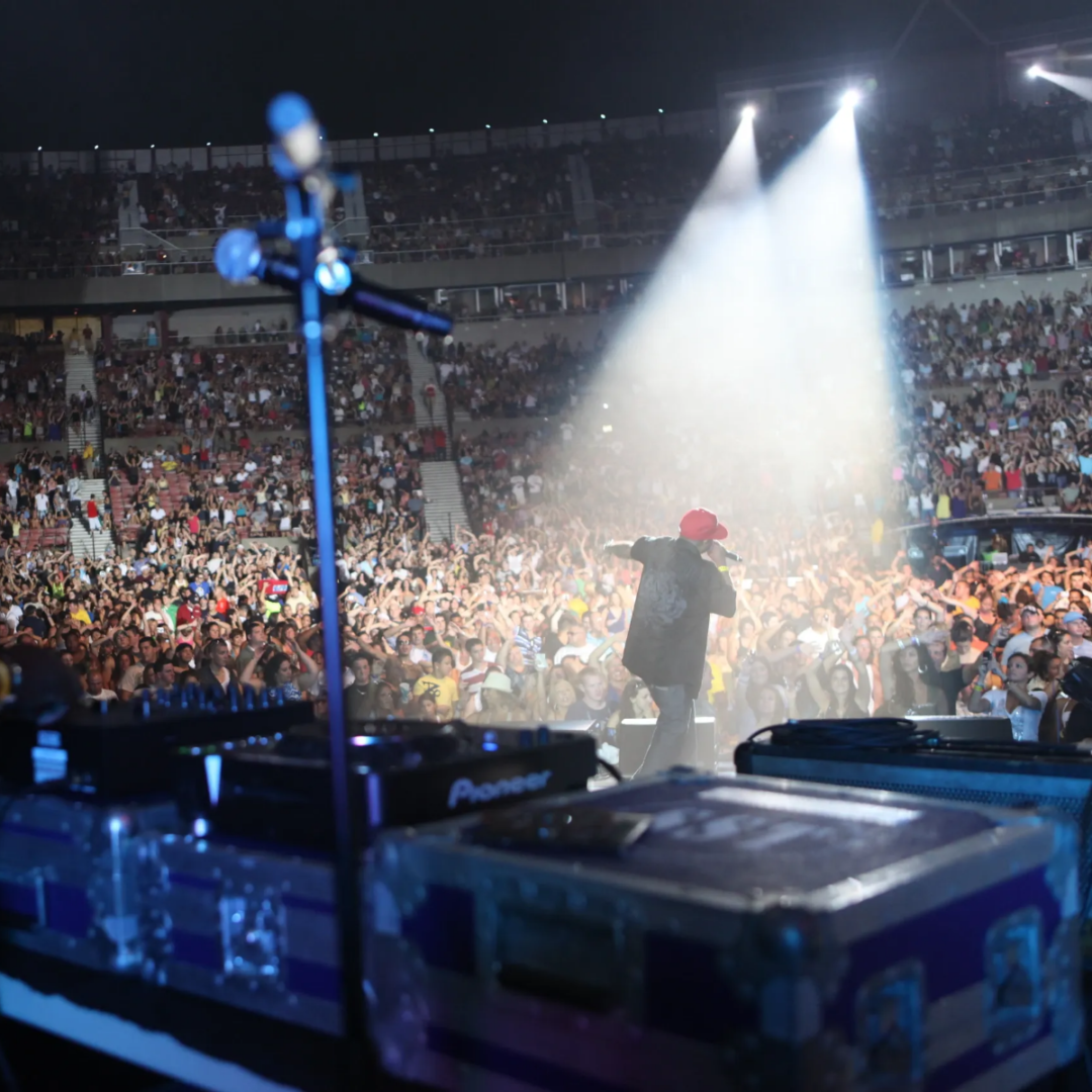 A crowd of people in the stands at an event.